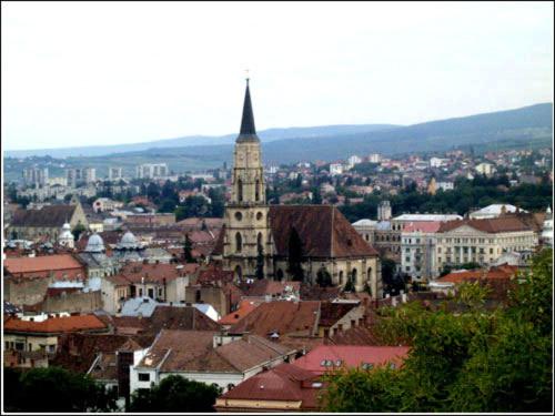 a view of a city with a church tower at Vila Casa Alesiv in Cluj-Napoca