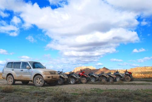 a group of motorcycles parked next to a truck at RuralSuite Hotel Apartamentos in Cascante