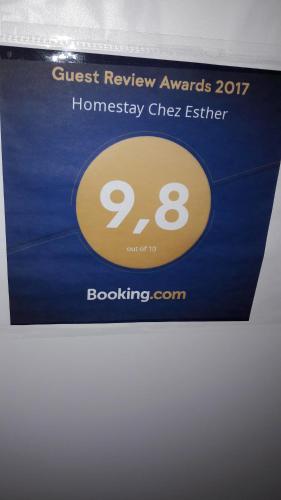 a sign for a guest review awards homesney cheez eight at Esther's Homestay - Big Room - 26 Square Meters in Horgen