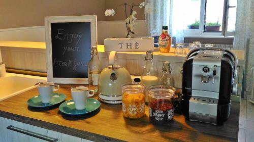 a kitchen counter with a coffee maker and a toaster at La Terrazza sul Naviglio B&B in Bernate Ticino