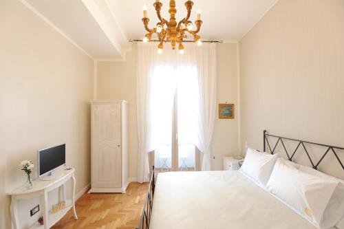 Ένα ή περισσότερα κρεβάτια σε δωμάτιο στο Residenza Borbonica