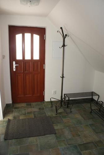 a room with a door and a bench next to a door at Guest House K74 in Jablonné v Podještědí