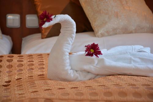 Ein Bett oder Betten in einem Zimmer der Unterkunft Spa & Wellness Hotel Harmonie