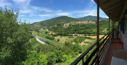 a view of a valley from the balcony of a house at bed and breakfast "il Picchio Verde" in Cittaducale