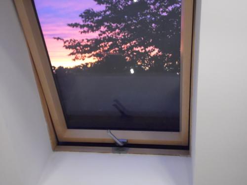 a picture of a television in a frame on a wall at Villa Śnieżka in Kowary