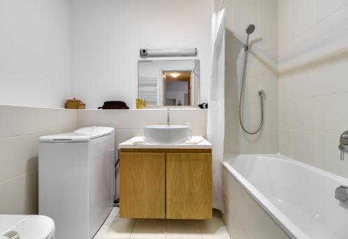 Ett badrum på Quality Point Apartments