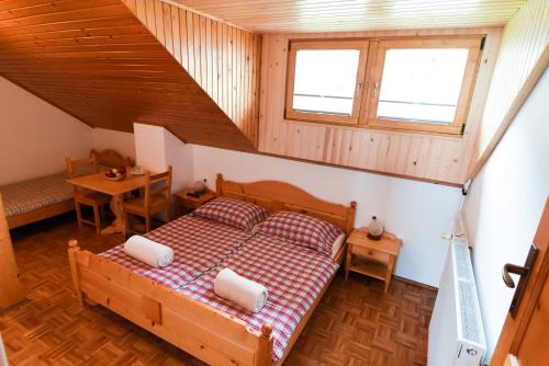 A bed or beds in a room at Tourist Farm "Pri Biscu"