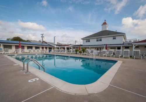 a large swimming pool in front of a building at Point Pleasant Manor in Point Pleasant Beach