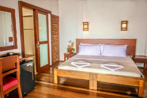 En eller flere senge i et værelse på Atlantis Dive Resort Dumaguete