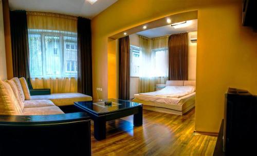 A bed or beds in a room at Guest House Elegance