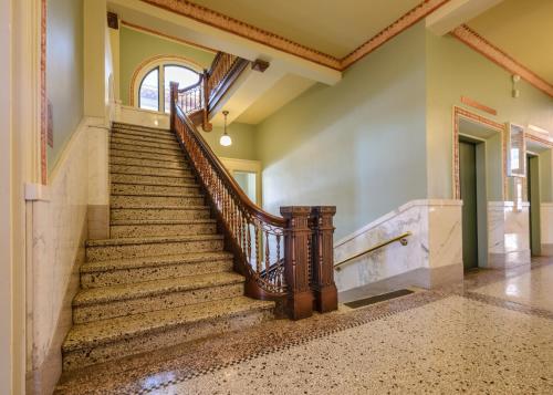 an image of a staircase in a house at Finlen Hotel and Motor Inn in Butte
