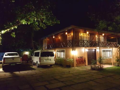 a van parked in front of a house at night at Stay Amare Villa Maria 1 in Bacolod