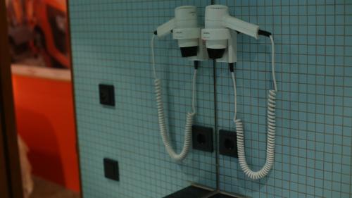 a pair of phones hanging on a wall at Drangar Country Guesthouse in Drangar