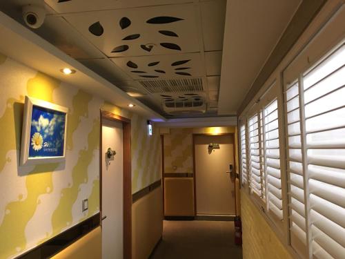 a hallway with a ceiling with fish on it at R8 Eco Hotel in Kaohsiung
