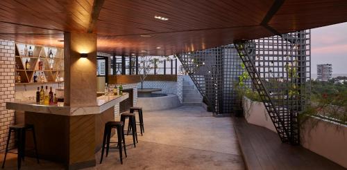 a bar on the roof of a building at Whale Hua Hin - SHA Plus in Hua Hin
