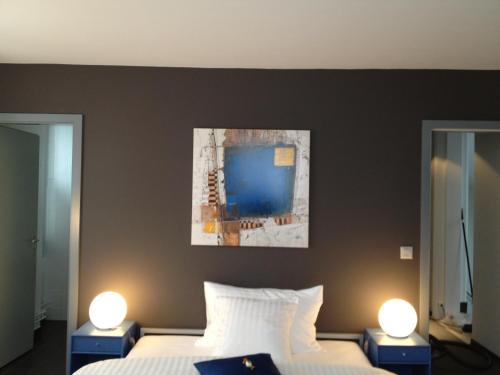 Cama o camas de una habitación en Au Boeuf Rouge