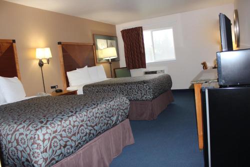 A bed or beds in a room at Days Inn by Wyndham Ritzville