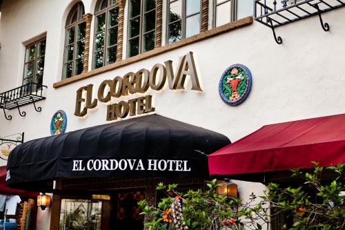 a store with a sign on the side of a building at El Cordova in San Diego