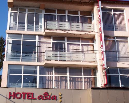 a hotel asia sign on the side of a building at Asia Hotel in Târgu Jiu