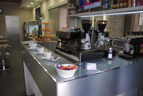 a kitchen with a counter with a coffee maker at Riviera Eden Palace in Cannes