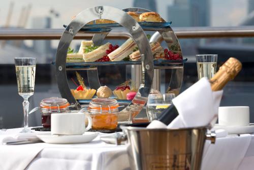a table with a plate of food on a table at Sunborn London Yacht Hotel in London
