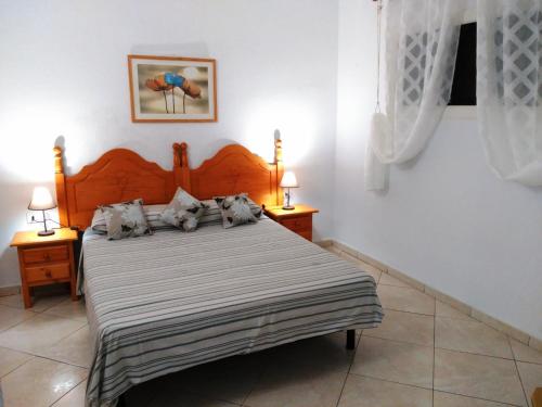 מיטה או מיטות בחדר ב-San Marino apartment