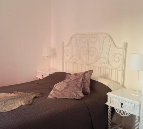 a bedroom with a large bed and two night stands at Tings Lisbon in Lisbon