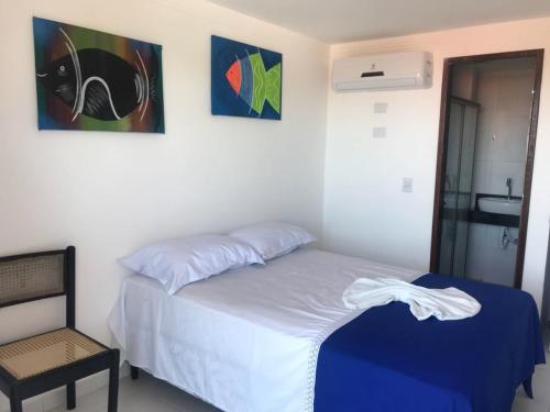 Ένα ή περισσότερα κρεβάτια σε δωμάτιο στο Porto Palace Pousada