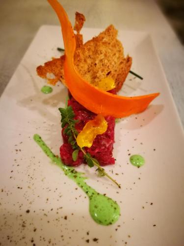 a plate of food on a white plate at Podere La Branda in Vetralla