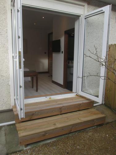 a sliding glass door leading into a room at Kilbree House B&B in Galway