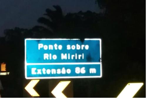 a street sign that reads ponchoo rio militar at A 2 passos do paraíso in Rio Tinto