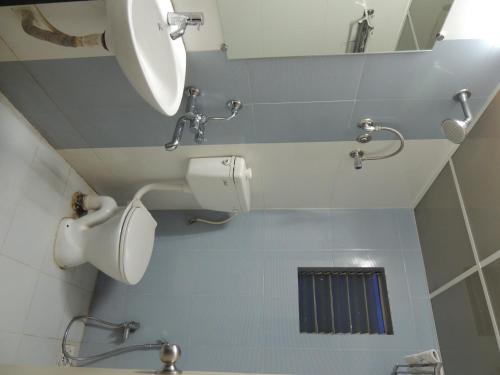 Koupelna v ubytování Hotel Pavitra