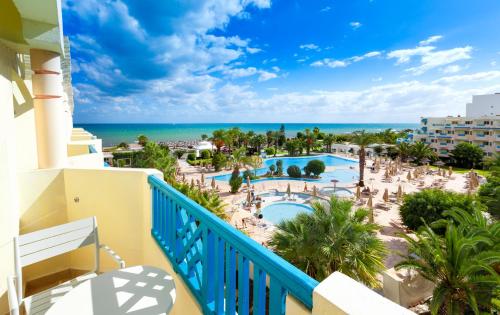 a view of the pool from the balcony of a resort at Sentido Bellevue Park in Port El Kantaoui