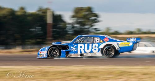 a blue racing car on a race track at Gran Texier Hotel Casino in Concepción del Uruguay