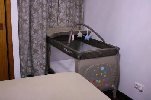 a bag sitting next to a bed in a room at Mericia's Gorgeous View in Funchal