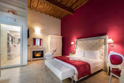 a hotel room with a bed and a television at Hotel Ginori Al Duomo in Florence