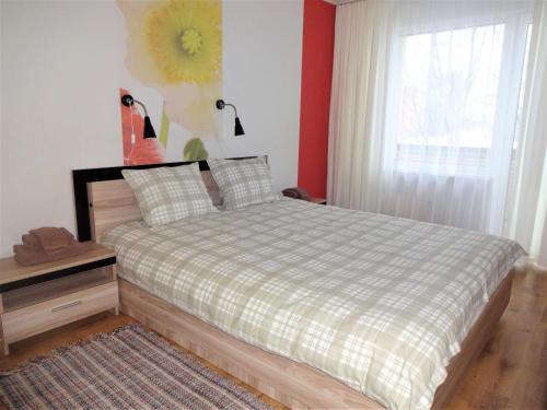 Ένα ή περισσότερα κρεβάτια σε δωμάτιο στο Kaktuss Apartamenti