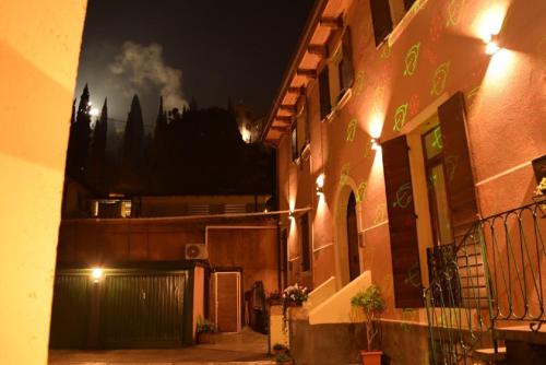 a view of a building at night with smoke at Veronauptoyou Apartments in Verona