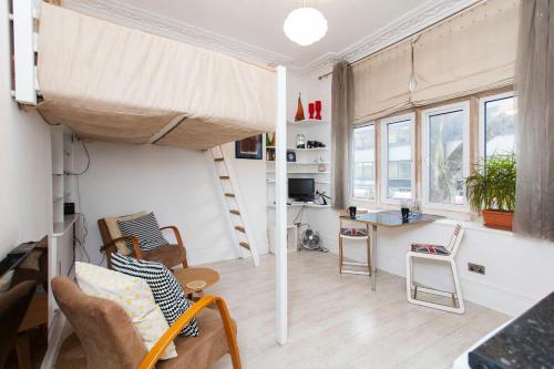a room with a loft bed and a desk at ItalianFlat - Shaldon in London