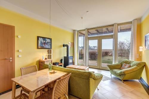 a living room with a couch and a table at Ferienwohnung Hering in Ueckeritz