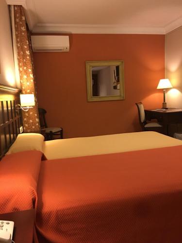 Ένα ή περισσότερα κρεβάτια σε δωμάτιο στο Hotel Sierra Hidalga