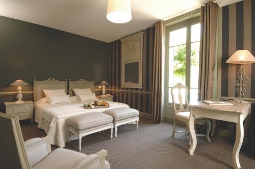 Ліжко або ліжка в номері Hôtel Helvie - Teritoria