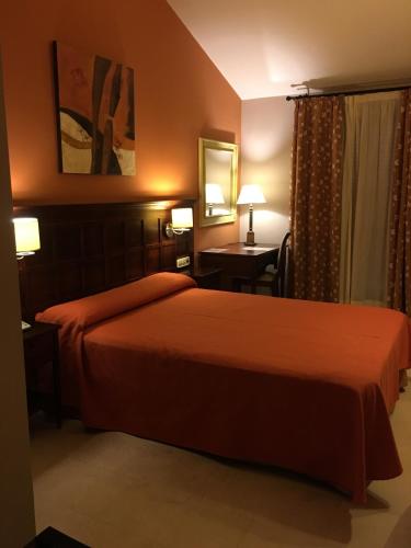 Ένα ή περισσότερα κρεβάτια σε δωμάτιο στο Hotel Sierra Hidalga