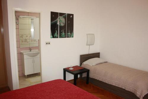 Postel nebo postele na pokoji v ubytování Guesthouse Matušan's place
