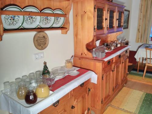 a kitchen with a counter with dishes on it at Haus Amalia in Strobl