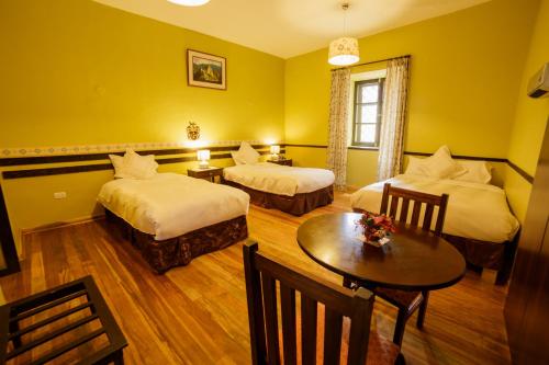Postel nebo postele na pokoji v ubytování Yabar Hotel Plaza