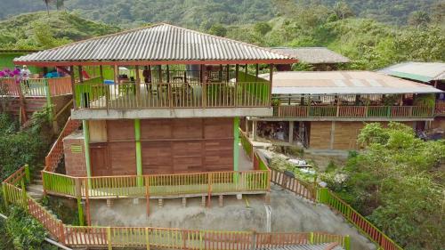 an aerial view of a house with balconies at Cabañas Ecoturisticas Y Club Gaira Tayrona in Santa Marta