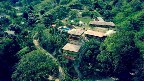 an aerial view of a house on a mountain at Cabañas Ecoturisticas Y Club Gaira Tayrona in Santa Marta