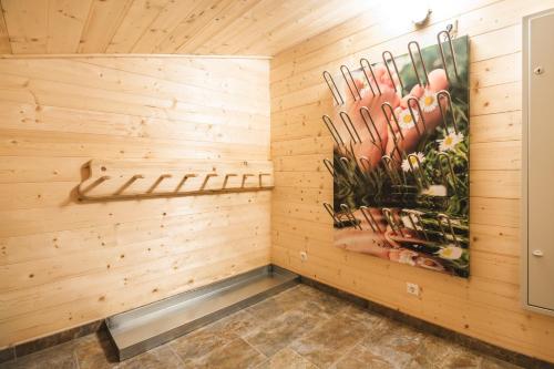 a sauna with a painting on the wall at Knusperhauschen Sonnegg in Flachau