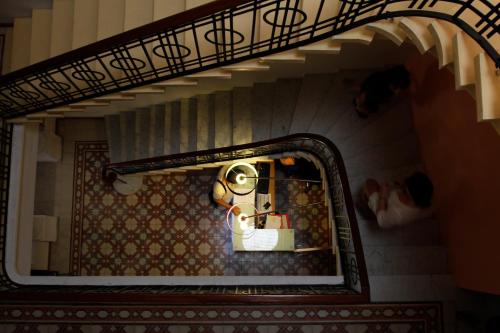 a view of a doll house through a mirror at Corner Hostel in Sliema